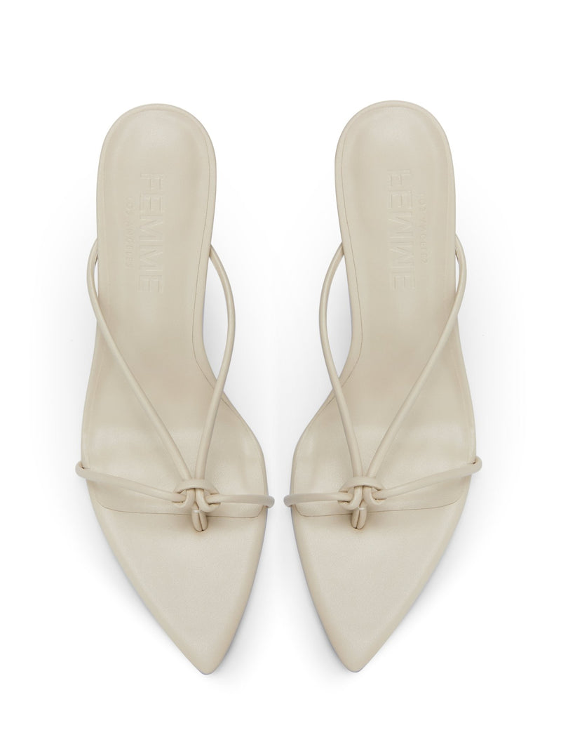 Akira Slipper in Cream – overhead pair view showing FEMME embossed cream insoles and knotted toe strap detail