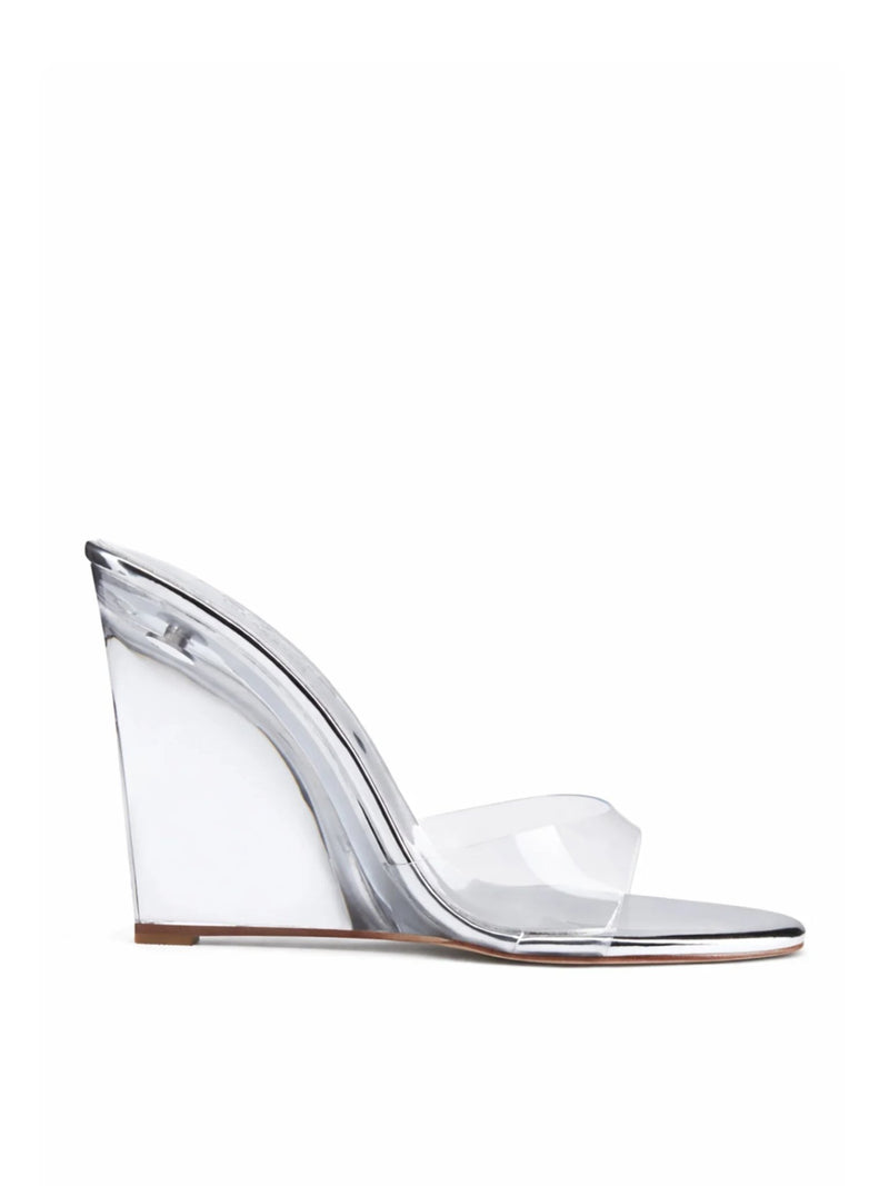 Azucar Wedge in liquid metal by FEMME LA, side view showing clear PVC wedge, single transparent strap, and silver metal trim