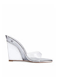 Azucar Wedge in liquid metal by FEMME LA, side view showing clear PVC wedge, single transparent strap, and silver metal trim