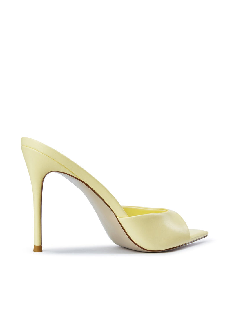 Bella Slipper in Baby Yellow – left side profile showing pale yellow satin padded vamp curve and slim stiletto heel