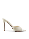 Bella Slipper in Nudist – side profile of ivory satin padded vamp mule with pointed toe and slim stiletto heel