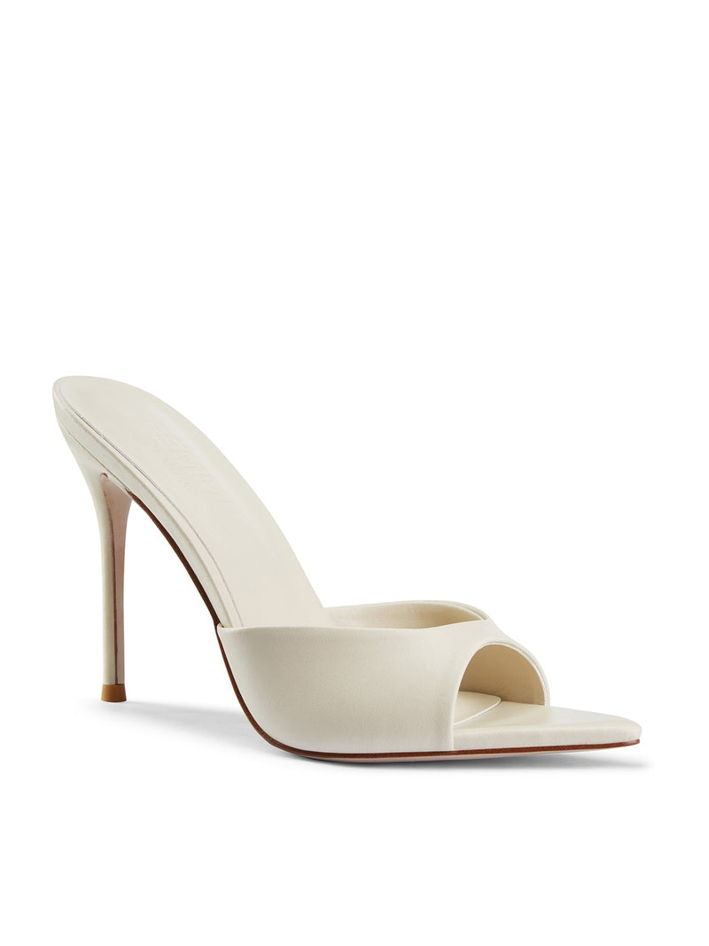 Bella Slipper in Nudist – front three-quarter view of ivory satin padded structured vamp and pointed toe
