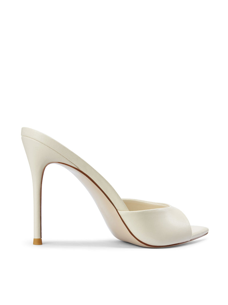 Bella Slipper in Nudist – close-up side profile of ivory satin padded vamp curve and slim stiletto heel