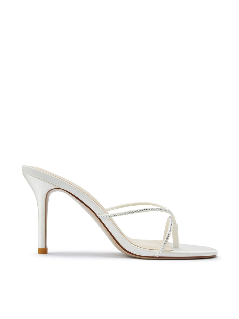 Femme LA Sicilian Slipper in White Crystal – side profile showing white satin body with clear crystal-embellished crossed straps on slim stiletto heel