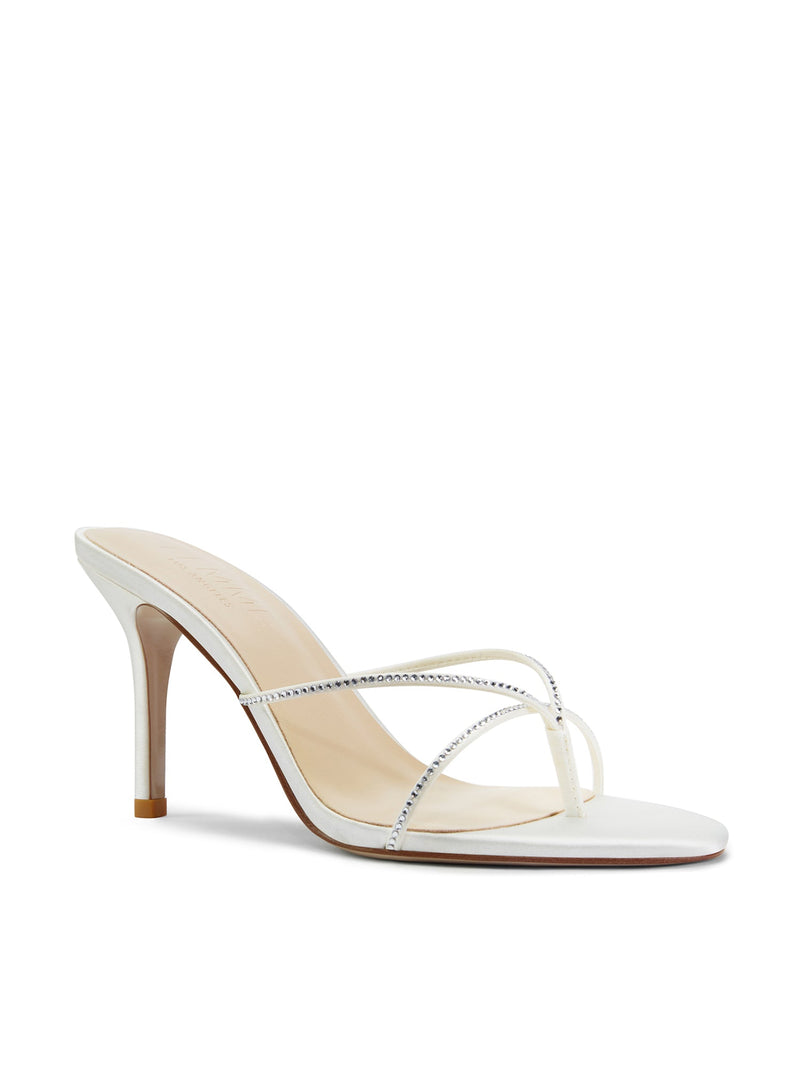 Femme LA Sicilian Slipper in White Crystal – front three-quarter view showing clear rhinestone crossed straps and cream insole